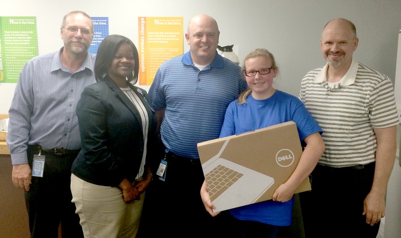 Submitted Photo Lyle Mercer, Cassie Hartaway, Steve Driggs and Danny Funkhouser of Walmart&#8217;s Print Solutions pose with Makenna Fletcher, a Gentry Middle School student awarded a new laptop computer from Walmart for an essay she wrote as part of the Mi Futuro program.