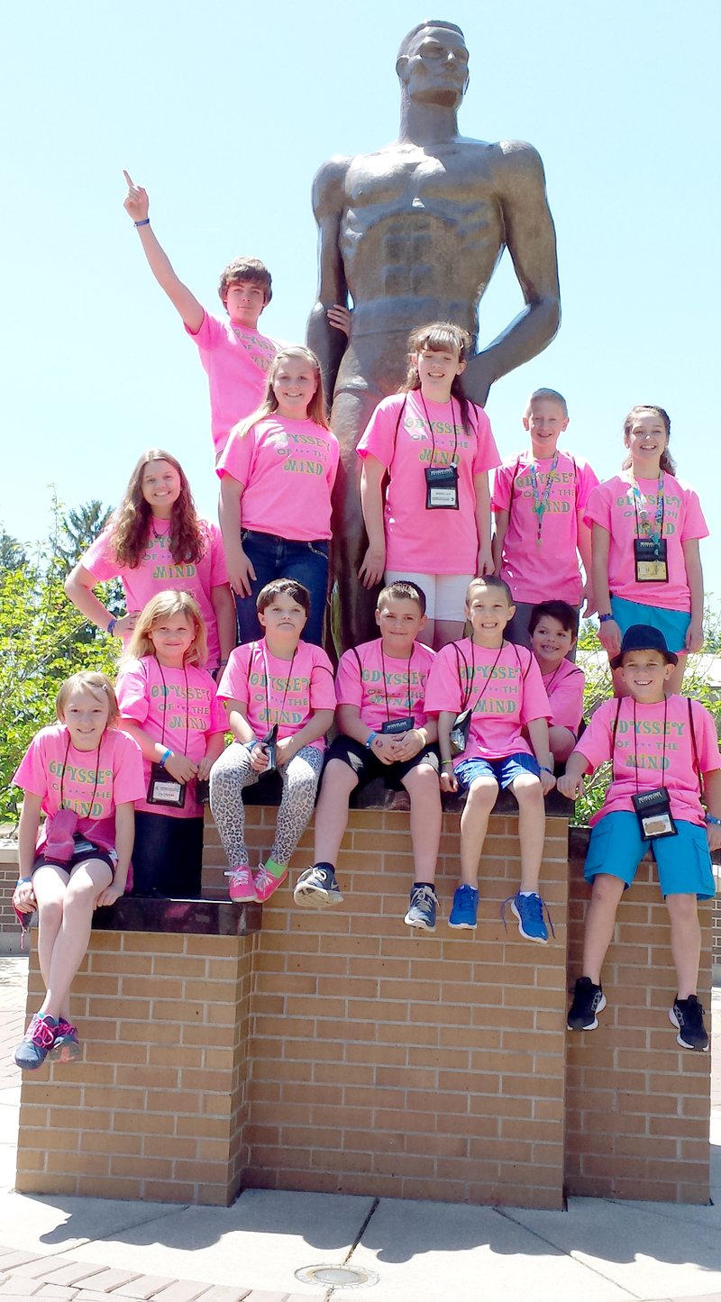 Submitted Photo While at world competition, Gentry Odyssey of the Mind teams posed in front of the Spartan Statue at Michigan State University. Pictured are: Averie Jeffus (front, left), Makenzie Riley, Jaylin Calcott, Tarren Christie, Dillon Owens, Cary Tromp, Tucker Hodges, Brently Wade (back, left), Gavin Taylor, Darien Welch, Victoria Barnes, Cory Hockenberry and Ashlyn Little.