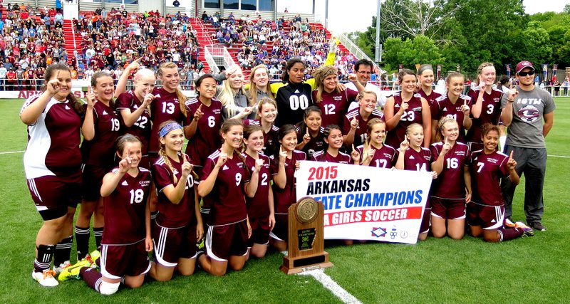 Photo by Mike Eckels The Gentry girls&#8217; soccer team takes a moment for pictures shortly after winning the 4A state soccer title at a game played at the University of Arkansas soccer field in Fayetteville May 22. The Pioneers defeated the Central Arkansas Christian Lady Mustangs, 2 to 0. For the story and more photos, see Page B1.