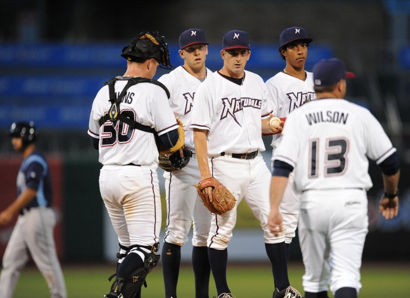 NWA Democrat-Gazette/ANDY SHUPE Vance Wilson, Northwest Arkansas Naturals manager, walks to the mound Tuesday to remove starting pitcher Jonathan Dziedzic after the Corpus Christi Hooks scored a run during the sixth inning at Arvest Ballpark in Springdale.