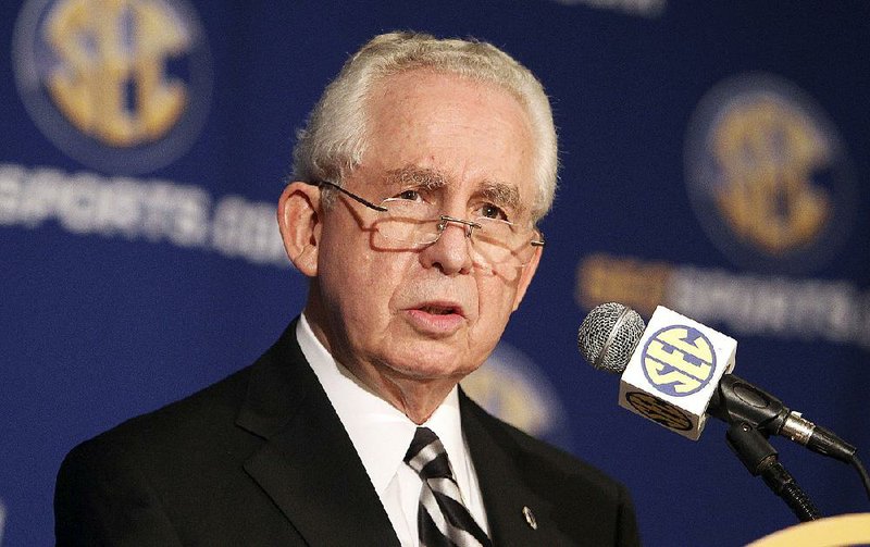 In this July 21, 2010, file photo, Southeastern Conference commissioner Mike Slive talks at a news conference during the SEC Media Days  in Hoover, Ala.  