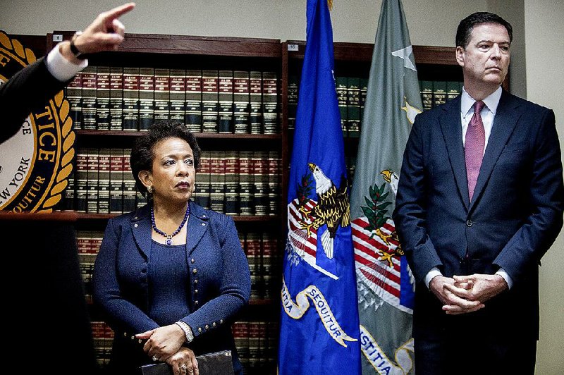 Attorney General Loretta Lynch, with FBI Director James Comey at a news conference Wednesday in New York, said FIFA officials “used their positions of trust within their respective organizations to solicit bribes from sports marketers” and did so “over and over, year after year, tournament after tournament.” 