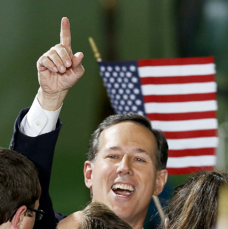 Rick Santorum celebrates Wednesday in Cabot, Pa., after announcing his bid for the 2016 Republican presidential nomination. He joins a crowded field of social conservatives in the race. 