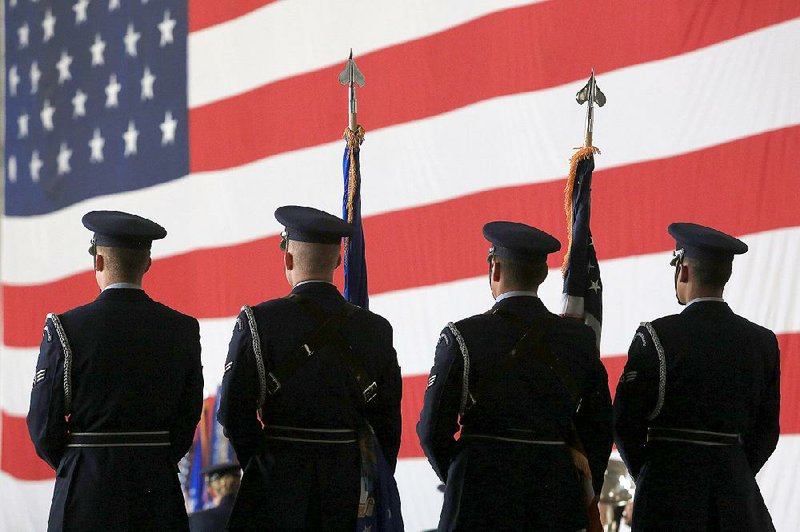 The honor guard at Little Rock Air Force Base prepares to present the colors during a change of command ceremony in Jacksonville on Wednesday. Col. Charles “Chip” Brown Jr. took command of the Air Force’s 19th Airlift Wing from Col. Patrick Rhatigan, who is retiring. 