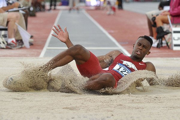 Arkansas jumper Jarrion Lawson lands during the NCAA West Preliminary on Thursday, May 29, 2014, at John McDonnell Field in Fayetteville. 