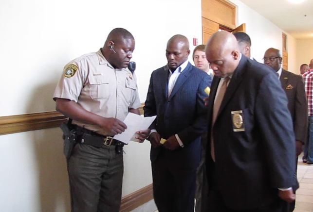 Boxer Jermain Taylor is served a second-degree battery warrant after his court appearance on Friday, May 29, 2015.