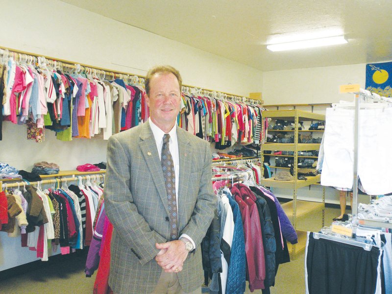 The Rotary Club of Bryant operates the Kids Closet at Friends in Christ Lutheran Church in Bryant. Emil Woerner, church pastor, shows some of the clothing items that are available to needy children in the community. Woerner is the incoming president of the local Rotary Club and will begin his term in office in July.