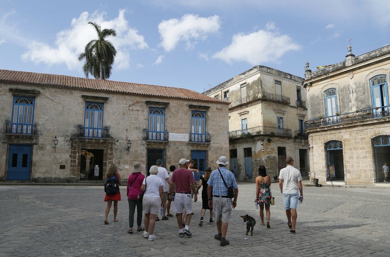 A group of American tourists on a guided tour visit Old Havana, Cuba, on Sunday, May 24, 2015. The Thaw in relations between the U.S. and Cuba has led to a dramatic 36 percent increase in visits by Americans to Cuba since January compared with the same period last year, along with a 14 percent rise in arrivals from around the world. 