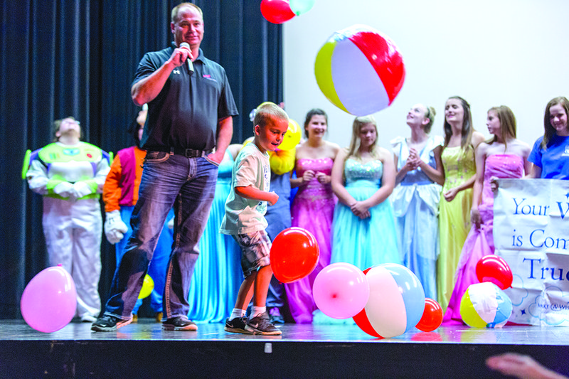 Blake Wilkerson kicks a beach ball after finding out he won a trip to Atlantis in the Bahamas during a school assembly at Beebe Junior High. Wilkerson’s trip through Make-A-Wish Foundation was funded by the FBLA chapter at the school.