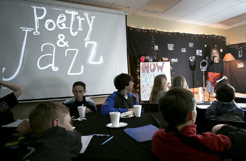 The Southern Fried Poetry Festival in Little Rock will be a regional event in the spirit of smaller happenings that occur around the state. Here, students at McNair Middle School in Fayetteville share poems in a classroom-turned-Poetry Cafe earlier this year.