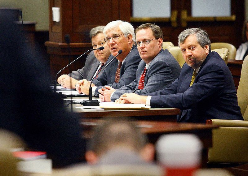 Department of Finance and Administration state budget director Brandon Sharp is shown (second from right) along with in this file photo with Tim Leathers, Richard Weiss and John Shelnutt (from left to right).

