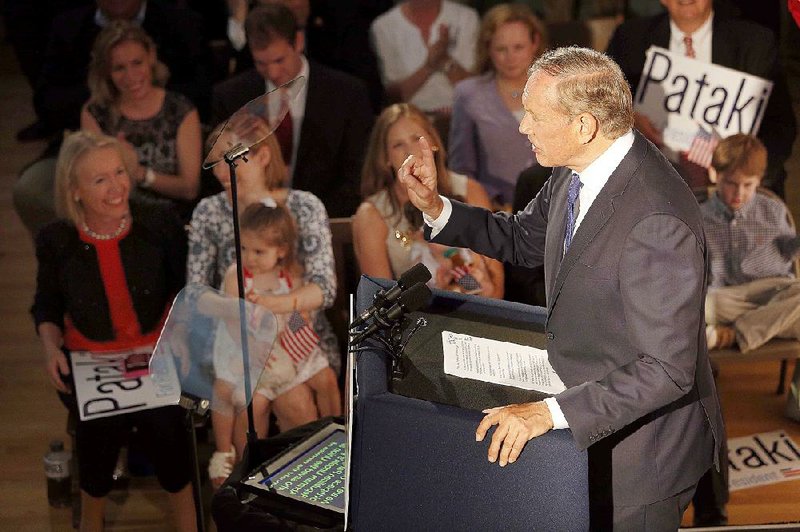 Former New York Gov. George Pataki declares his candidacy for the GOP presidential nomination Thursday at the historic town hall in Exeter, N.H. Pataki is the eighth Republican to enter the race. 