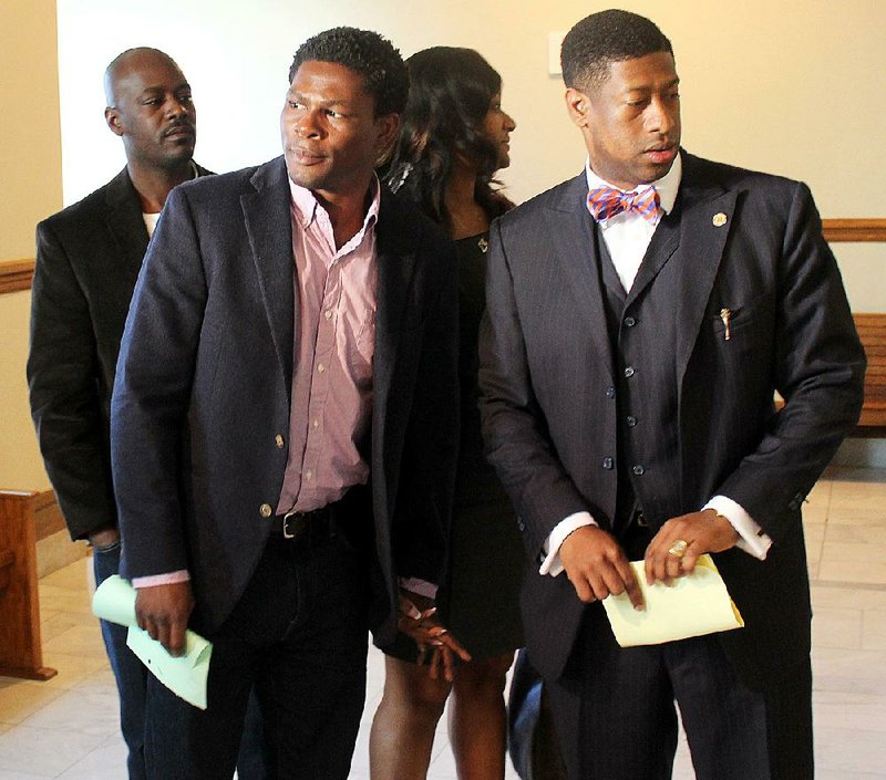 Boxer Jermain Taylor leaves Pulakski County Circuit Court with his attorney, Jimmy Morris (right), in this file photo from March 30, 2015. 