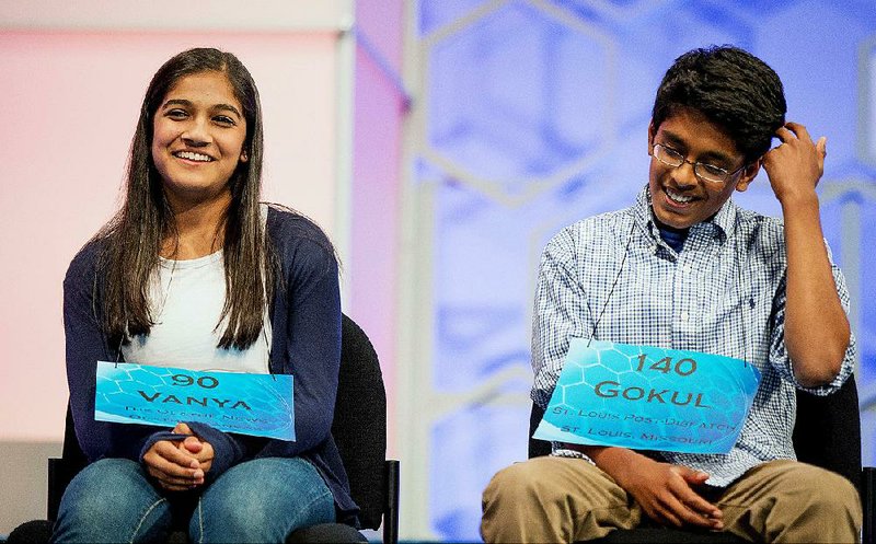 Vanya Shivashankar (left), 13, and Gokul Venkatachalam, 14, finished the competition Thursday with Vanya spelling “scherenschnitte” and Gokul nailing “nunatak.” 