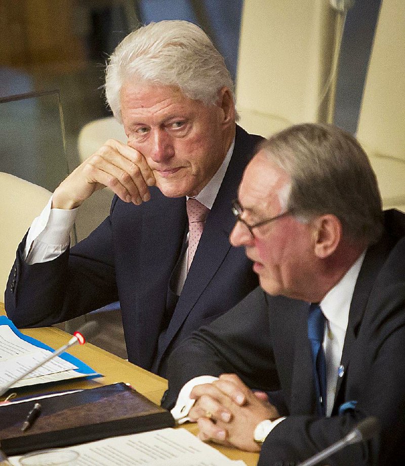 Former President Bill Clinton sits with U.N. Deputy Secretary-General Jan Eliasson during a U.N. meeting Thursday where Clinton said the Ebola outbreak was a “man-made disaster” caused by poor health care. 