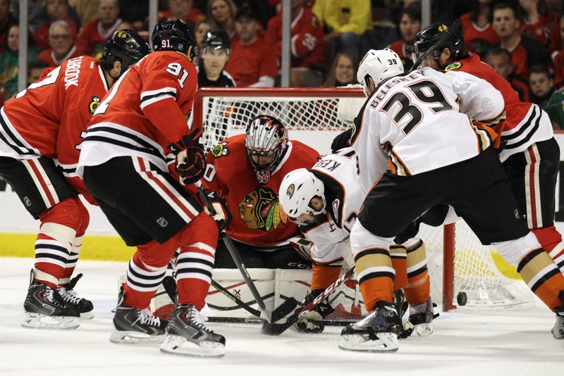 Chicago Blackhawks goalie Corey Crawford (50) stops an Anaheim Ducks center Ryan Kesler (17) shot during the first period in Game 6 of the Western Conference finals of the NHL hockey Stanley Cup Playoffs, Wednesday, May 27, 2015, in Chicago. 