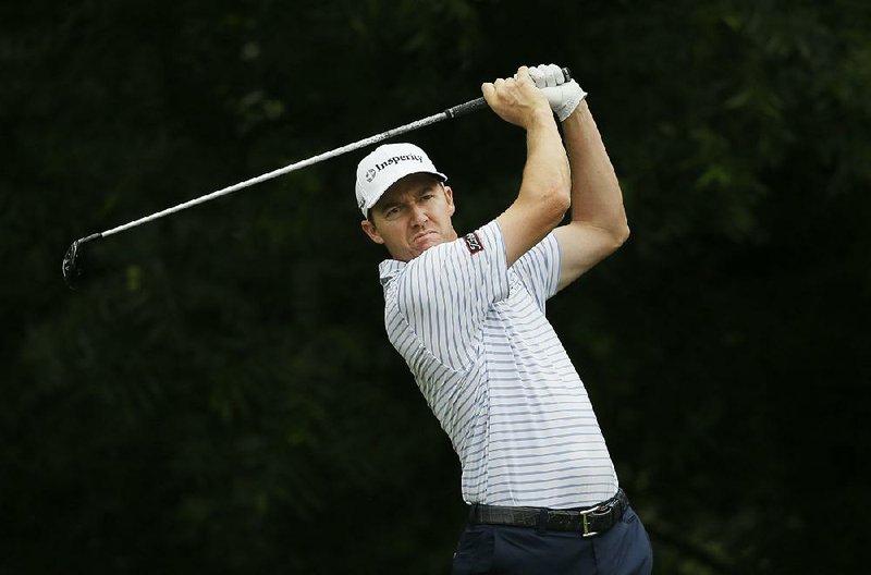 Jimmy Walker watches a tee shot during the third round of the Colonial golf tournament, Saturday, May 23, 2015, in Fort Worth, Texas.