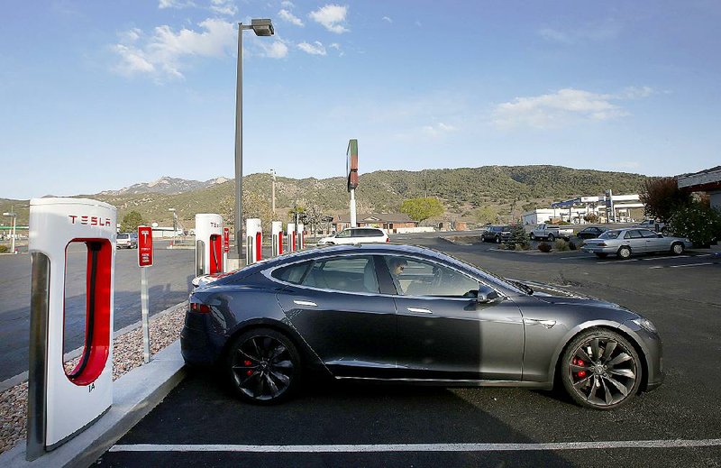 A Tesla Motors Model S sits at a charging station in Nephi, Utah, in April. Tesla failed to convince Texas lawmakers that it should be allowed to sell its electric cars directly to buyers. 
