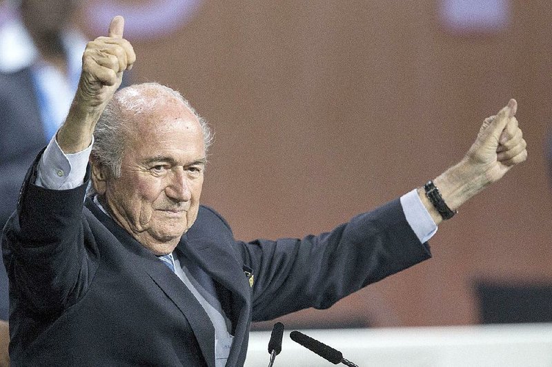Sepp Blatter celebrates his re-election as president Friday at FIFA headquarters in Zurich. 
