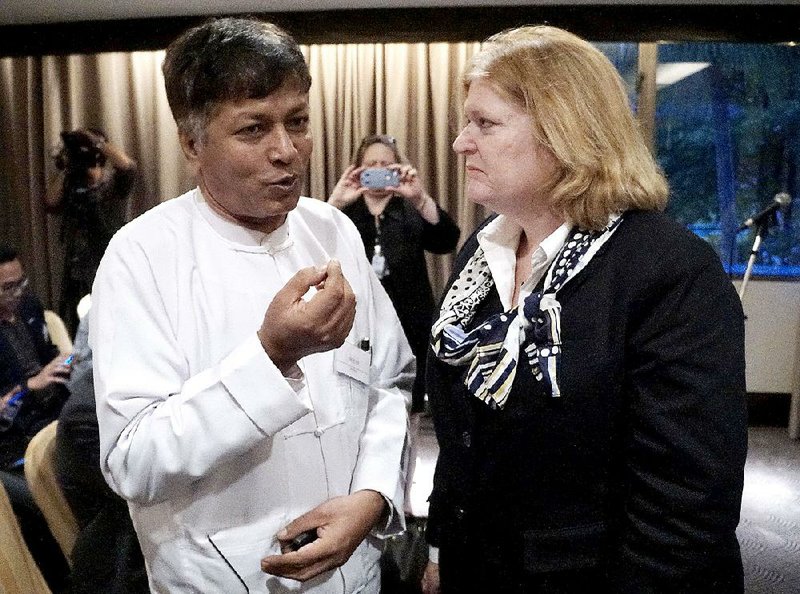 Maung Kyaw Nu of Thailand’s Burmese Rohingya Association speaks with Anne Richard from the U.S. State Department after Friday’s meeting in Bangkok on Asia’s migration crisis.