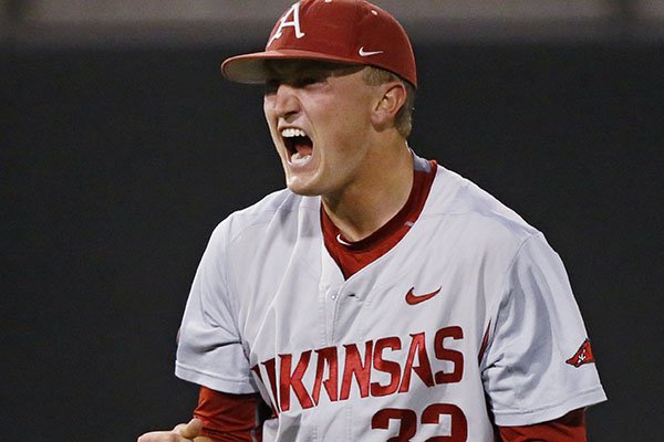 Arkansas pitcher Zach Jackson celebrates at the end of an NCAA college baseball tournament regional game against St. John's, in Stillwater, Okla., Sunday, May 31, 2015. Arkansas won 4-3 and moves on to the super regional. (AP Photo/Sue Ogrocki)