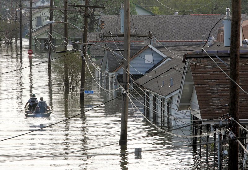 In a Aug. 30, 2005 file photo, rescue personnel search from victims as they traverse the New Orleans 8th Ward in the flooded city of New Orleans after the onslaught of Hurricane Katrina. Cities like Tampa, Houston, Jacksonville and Daytona Beach historically get hit with major hurricanes every 20 to 40 years, according to meteorologists. 