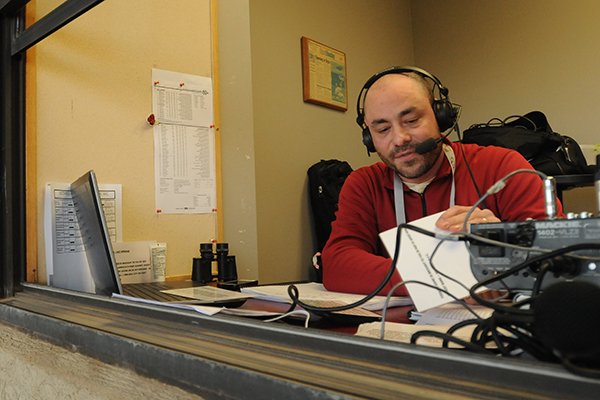 Arkansas play-by-play announcer Phil Elson prepares prior to a game against North Dakota on Friday, Feb. 13, 2015, at Baum Stadium in Fayetteville.