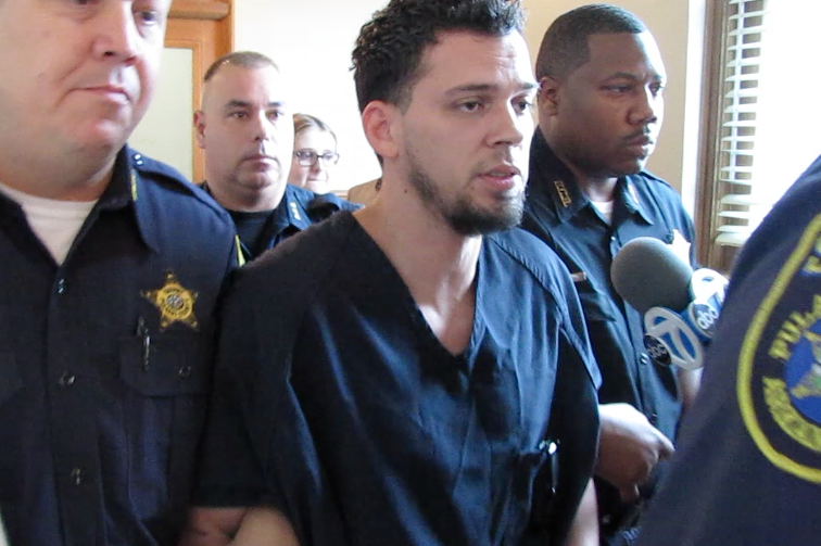 Arron Lewis is escorted out of court after a hearing Monday, June 1, 2015.