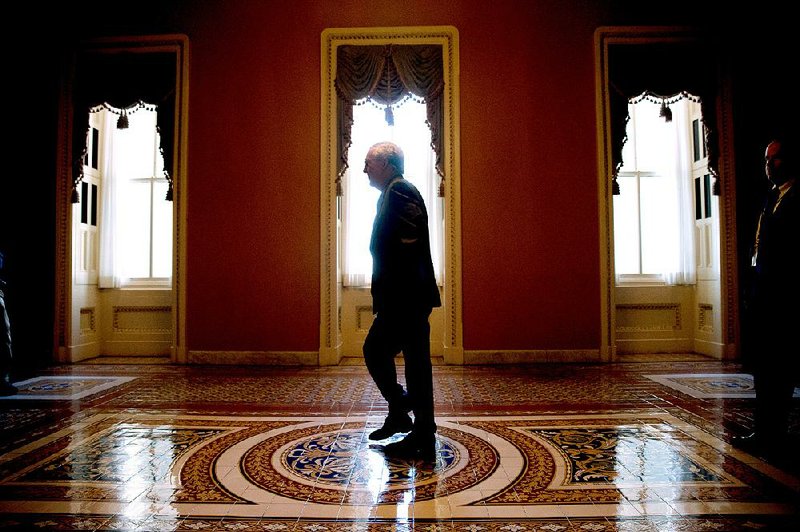 Senate Majority Leader Mitch McConnell of Kentucky arrives Monday on Capitol Hill in Washington before debate continued in the Senate on renewing the Patriot Act. 