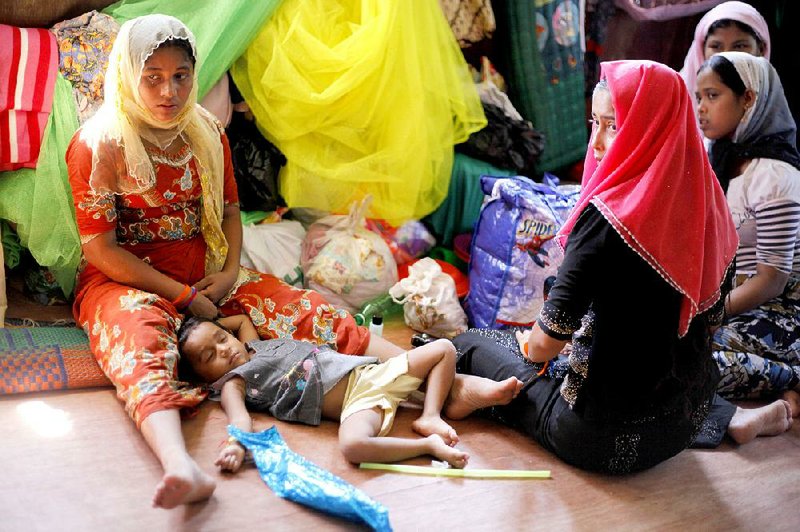 Rohingya travelers are shown at a temporary shelter in Bayeun, Aceh province, Indonesia on Monday. 