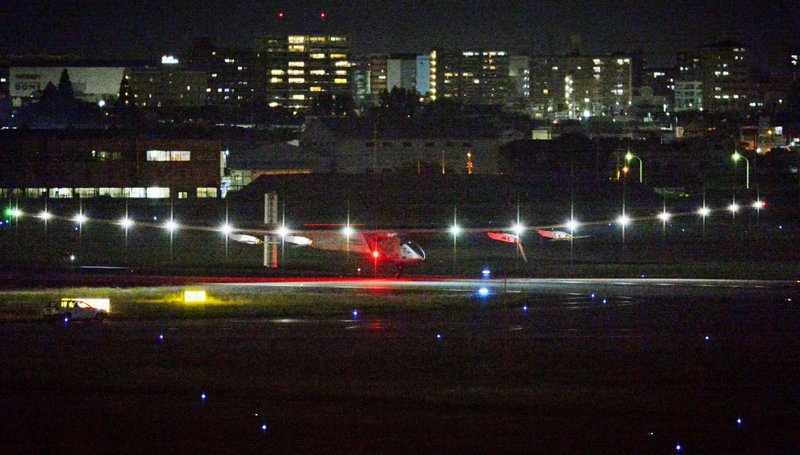 The Solar Impulse 2 touches down Nagoya Airport in Toyoyama, near Nagoya, central Japan Monday, June 1, 2015. The solar-powered plane attempting to circle the globe without a drop of fuel made an unscheduled landing late Monday in Japan to wait out bad weather.