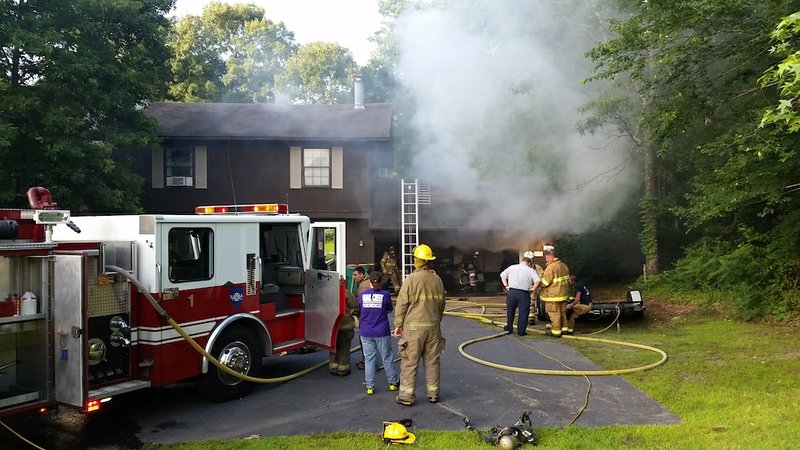 Firefighters work a blaze at 3019 W. Dixon Road in Little Rock on Tuesday, June 2, 2015.