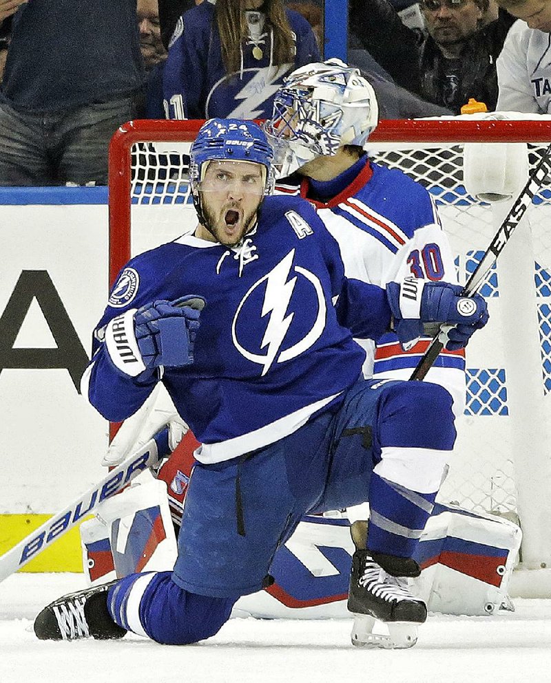 Tampa Bay’s Ryan Callahan celebrates a goal in front of New York Rangers goalie Henrik Lundqvist, his only score in the Lightning’s past 19 games after scoring 24 in the regular season. 