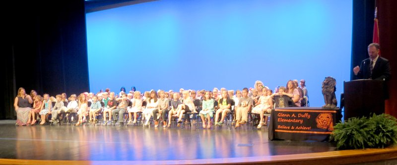 Photo by Susan Holland One hundred and twenty kindergarten students sat on the stage at the Performing Arts Center May 27 as Zane Vanderpool, principal of Glenn Duffy Elementary School, congratulated them for their graduation and recognized those who had won special awards. Most found it was hard to sit still and not do at least a little squirming in their chairs after such an exciting morning.