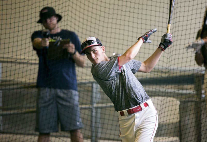 Logan Easley of Rogers Heritage practices Monday in the batting cages at Arvest Ballpark in Springdale.