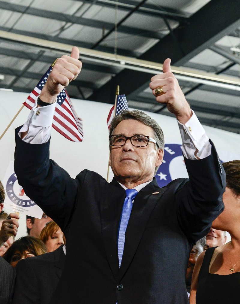 Former Texas Gov. Rick Perry acknowledges supporters Thursday in Addison, Texas, after announcing his Republican presidential campaign. 