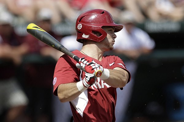 Arkansas' Andrew Benintendi swings during the first inning in a super regional of the NCAA college baseball tournament against Missouri State., in Fayetteville, Ark., Friday, June 5, 2015. (AP Photo/Danny Johnston)