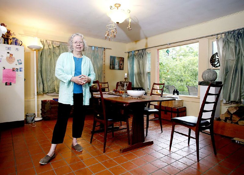 Jo Ann Kaminsky in her favorite personal space Thursday May 28, 2015, the dining area in her Fayetteville home.
