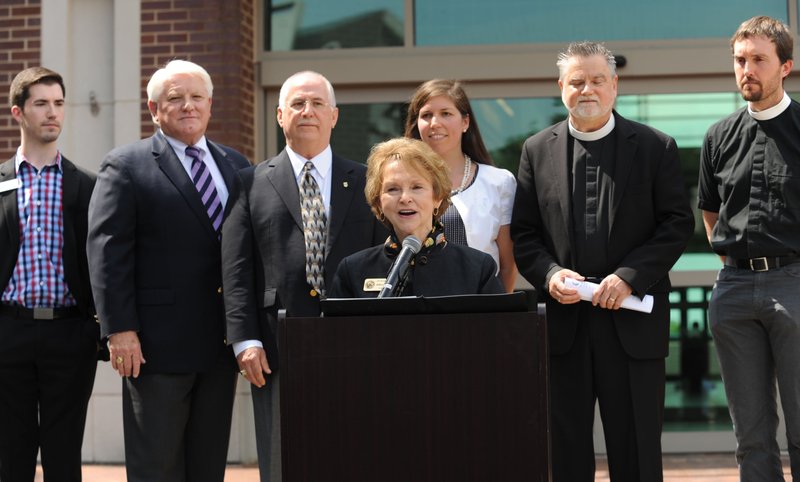 NWA Democrat-Gazette/ANDY SHUPE Adella Gray (center), Fayetteville alderwoman, speaks Friday during a news conference to announce a new anti-discrimination ordinance at the Fayetteville Town Center. With Gray are (from left) Chaz Allen of the NWA Center for Equality; Steve Clark of the Fayetteville Chamber of Commerce; Mark Martin, local attorney; Danielle Weatherby, University of Arkansas law professor; The Rev. Lowell Grisham, rector of St. Paul&#8217;s Episcopal Church in Fayetteville; and The Rev. Clint Schnekloth, lead pastor at Good Shepherd Lutheran Church in Fayetteville.