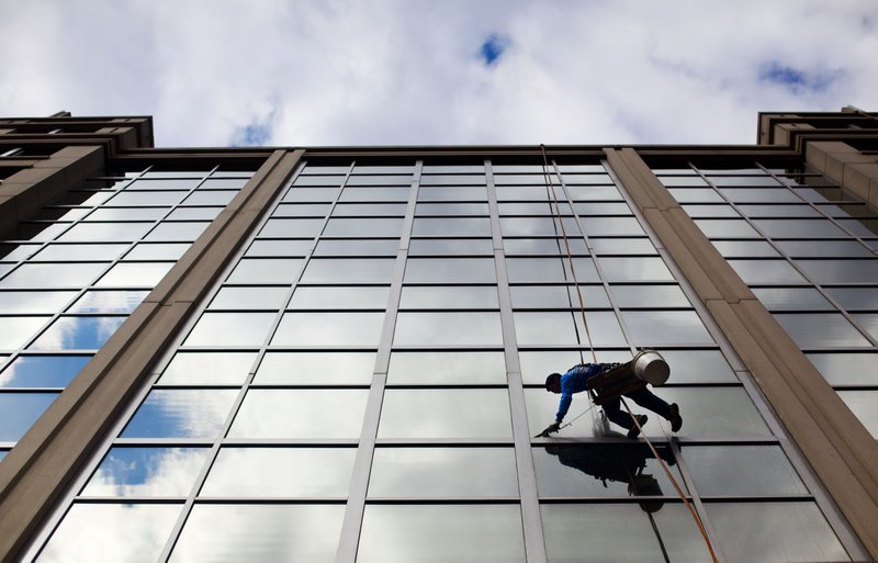 In this April 23 file photo, a window washer cleans the windows of an office building in downtown Washington. U.S. employers added 280,000 jobs in May, according to the U.S. government's May jobs report issued Friday.