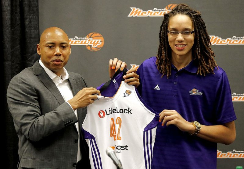 Brittney Griner (right)  is shown in this file photo from 2013 with  Phoenix Mercury head coach Corey Gaines.