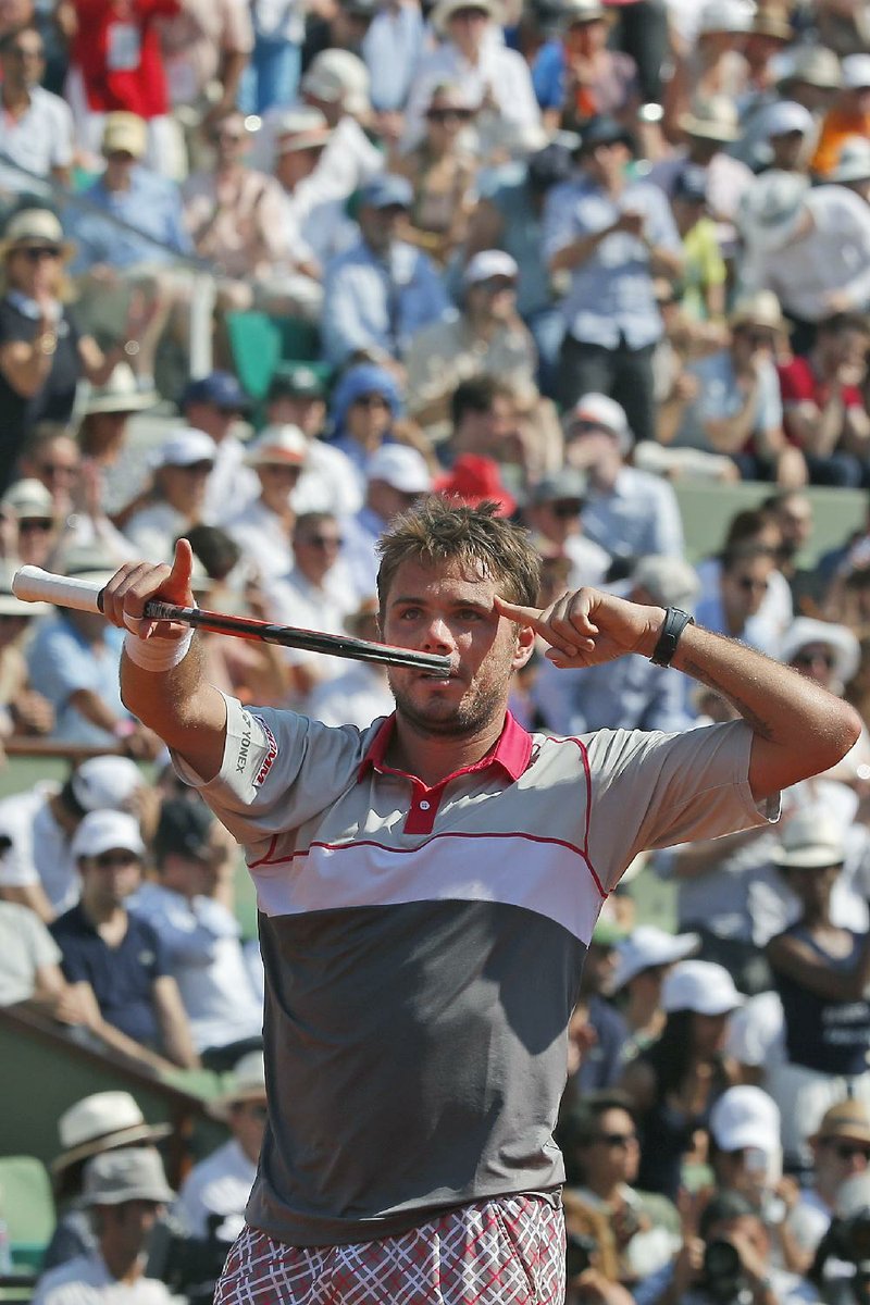 Stan Wawrinka (above) defeated Jo-Wilfried Tsonga in a French Open semifinal Friday. The other semifinal between Novak Djokovic and Andy Murray was suspended because of rain and will resume today with Murray leading 6-3, 6-3, 5-7. The fourth set was tied 3-3 before the match was stopped. 