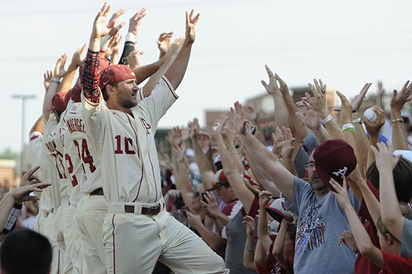 Arkansas players celebrate with fans following the Razorbacks' 3-2 win over Missouri State on Sunday, June 7, 2015, at Baum Stadium in Fayetteville. Arkansas advanced to the College World Series. 