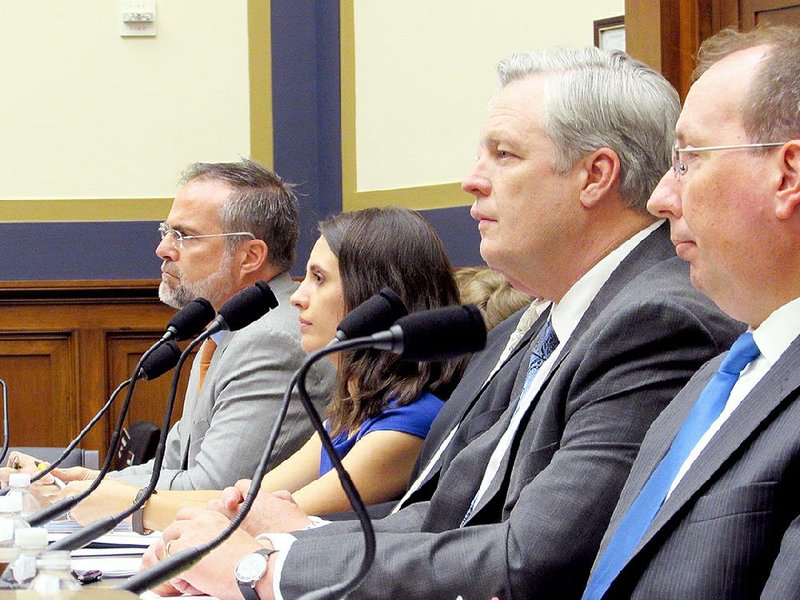 Rachael Cox, with Conway Machine Inc. in Conway, testifies Wednesday before the House Financial Services Committee. Seated with her are (from left) Daniel Ikenson of the Cato Institute, Michael Boyle of Boyle Energy Services and Technology, and Clifford Smith of Cliffs Natural Resources. 