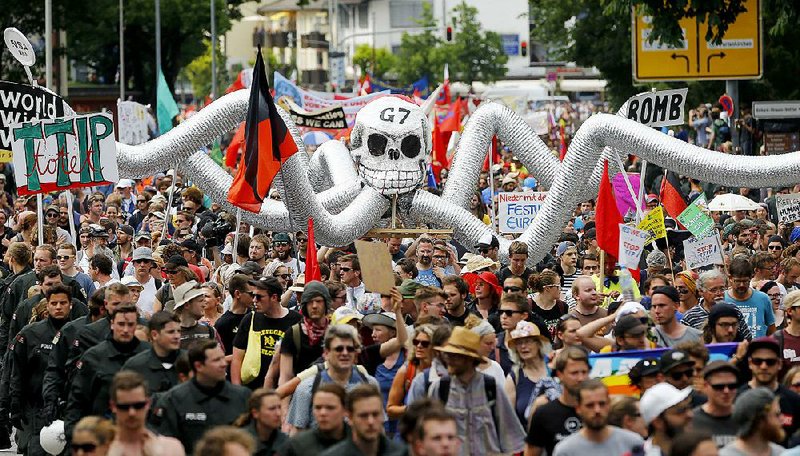 Demonstrators pack the street Saturday in Garmisch-Partenkirchen, Germany, ahead of today’s start of the Group of Seven summit. Protesters’ chants included opposition to war, police violence and the trans-Atlantic trade deal.  