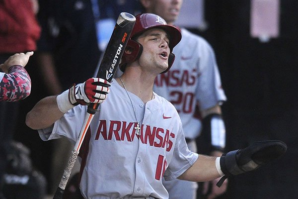 Arkansas outfielder Andrew Benintendi celebrates after scoring a run during the eighth inning of a game against Oklahoma State on Saturday, May 30, 2015, at Allie P. Reynolds Stadium in Stillwater, Okla. 