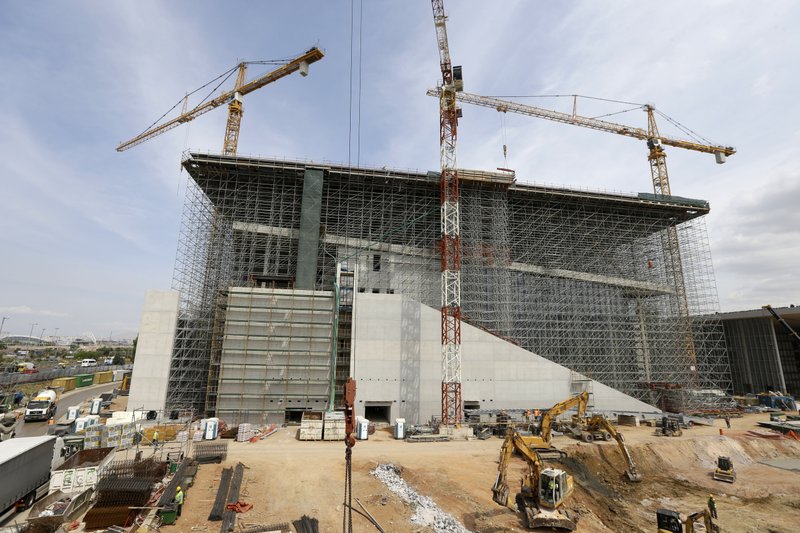 Cranes operate at the construction site of the Stavros Niarchos Culture Center where the new opera house and national library will be completed in 2016, in southern Athens, on Monday, June 8, 2015. The 566-million euro project is one of the country's few privately funded projects since the country was struck by a major financial crisis in 2009. 