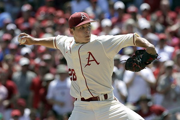 Arkansas' James Teague pitches during the first inning in a super regional game of the NCAA college baseball tournament against Missouri State in Fayetteville, Ark., Sunday, June 7, 2015. (AP Photo/Danny Johnston)