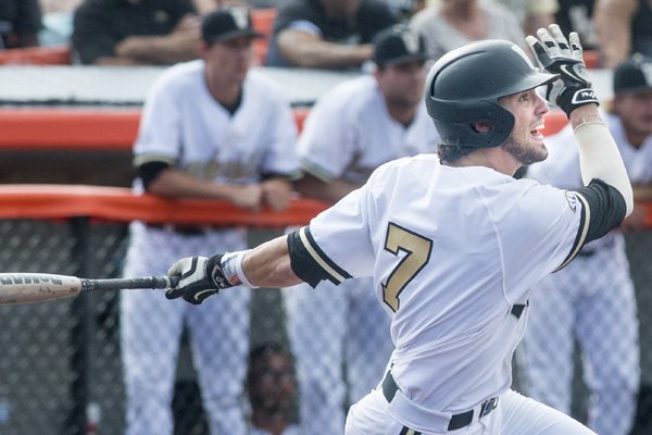 Shortstop Dansby Swanson of the Vanderbilt Commodores looks on