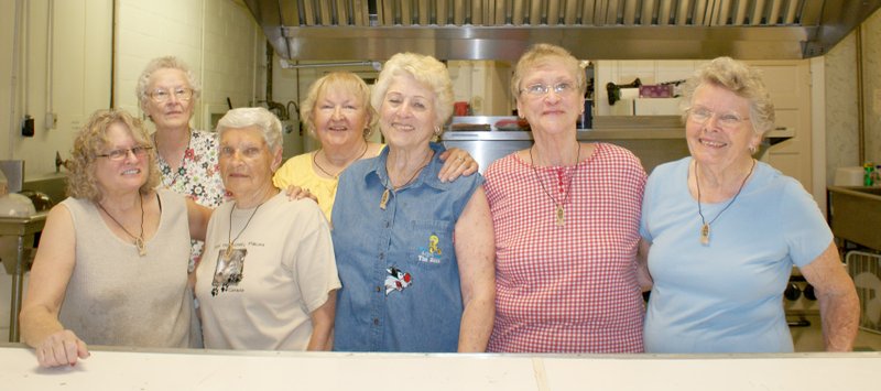 Photo by Dodie Evans Members of the Sulphur Springs Friendly Neighbors Club took a short break from their kitchen duties to pose for the camera. The ladies prepared the beans and corn bread for Friday night&#8217;s reunion dinner and a fried chicken dinner for Saturday&#8217;s noon meal.